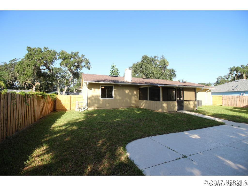 2007 Orange Tree Drive Edgewater, FL 32141 - Photo 20 of 23 a view of a yard in front of a house with a large tree