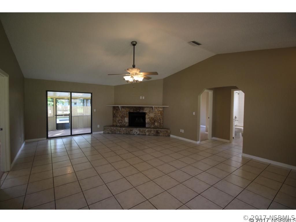 2007 Orange Tree Drive Edgewater, FL 32141 - Photo 3 of 23 a living room with furniture and a chandelier