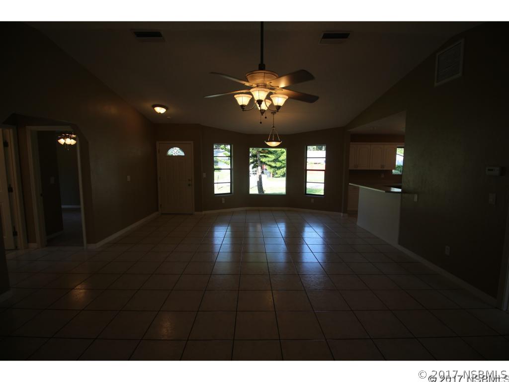 2007 Orange Tree Drive Edgewater, FL 32141 - Photo 5 of 23 a view of a lobby with furniture and a chandelier