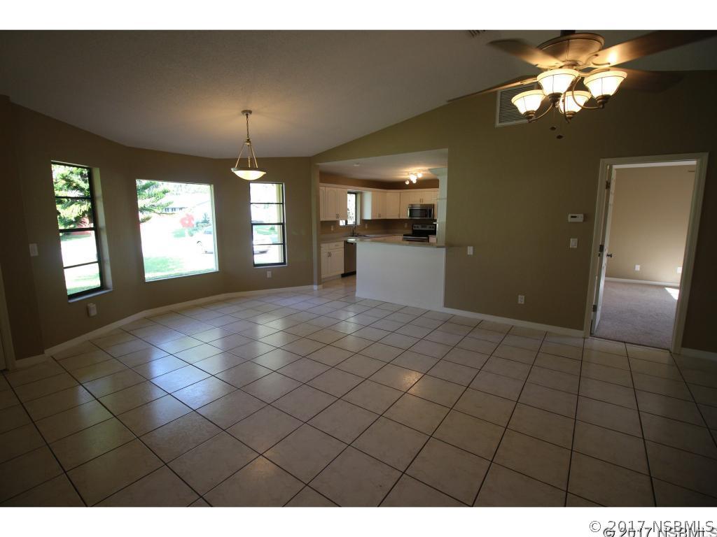 2007 Orange Tree Drive Edgewater, FL 32141 - Photo 6 of 23 a view of livingroom with kitchen and window