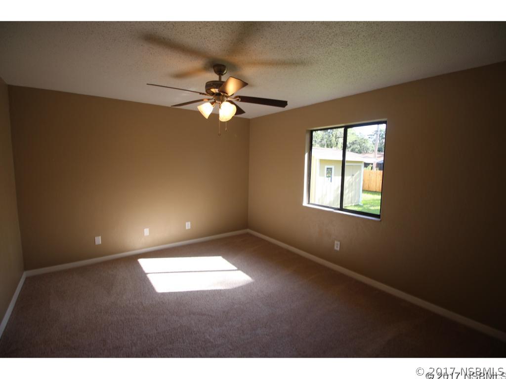 2007 Orange Tree Drive Edgewater, FL 32141 - Photo 10 of 23 a view of an empty room with a window