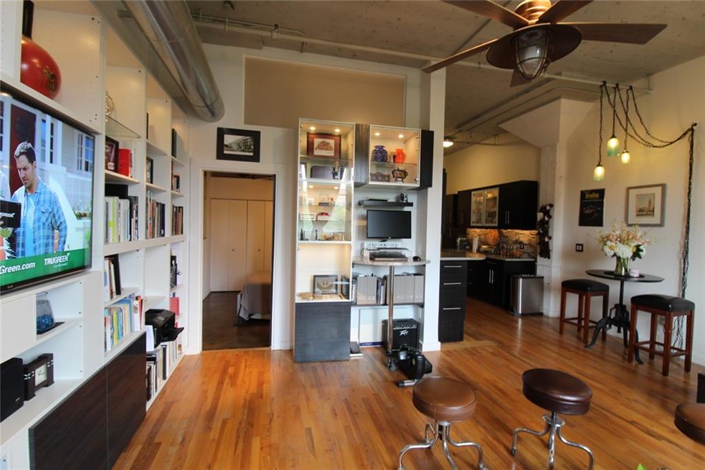 172 Haynes Street Southwest, Unit 208 Atlanta, GA 30313 - Photo 14 of 30 a living room with lots of furniture and kitchen view