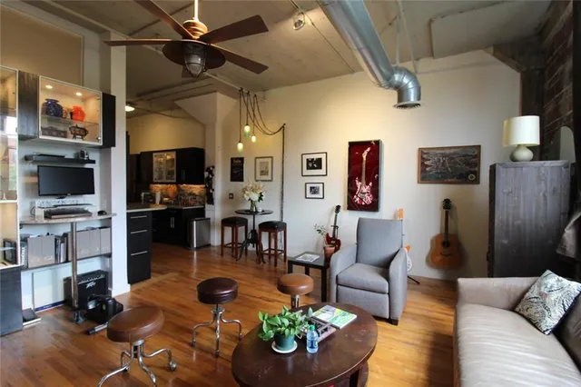 a living room with furniture and a flat screen tv