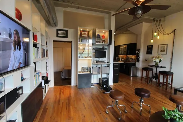 a living room with fireplace furniture and a flat screen tv