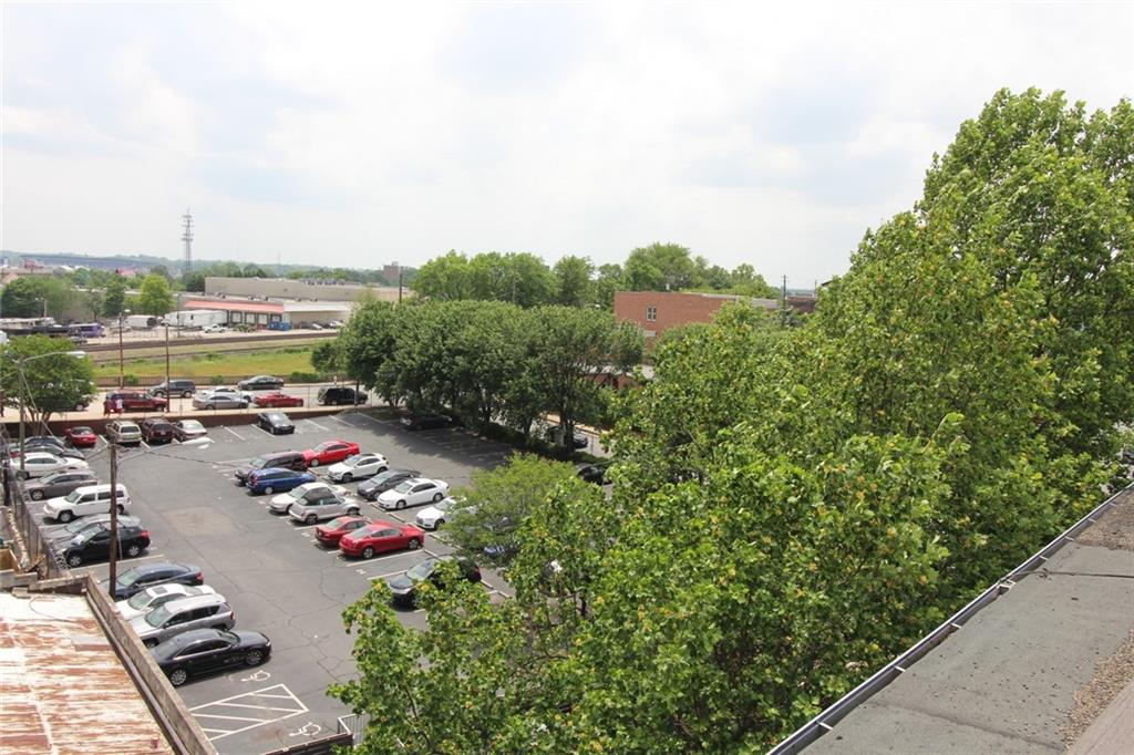 172 Haynes Street Southwest, Unit 208 Atlanta, GA 30313 - Photo 23 of 30 a view of a terrace with lawn chairs and couches