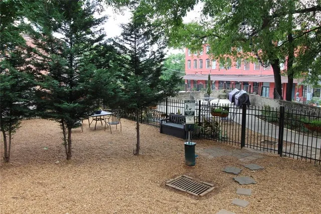 a view of a backyard and patio