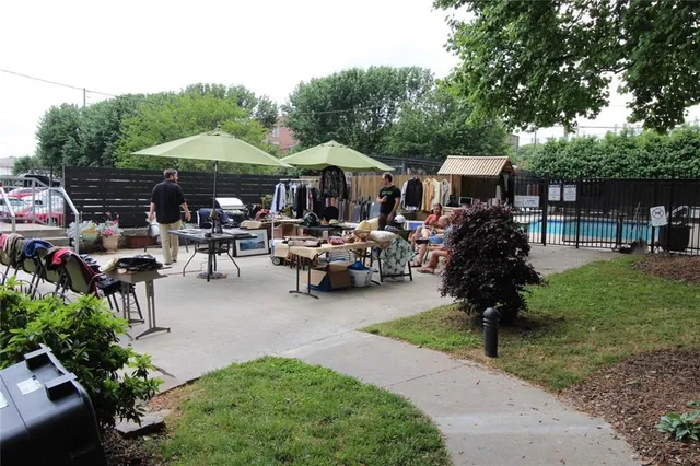 a view of a patio with table and chairs under an umbrella