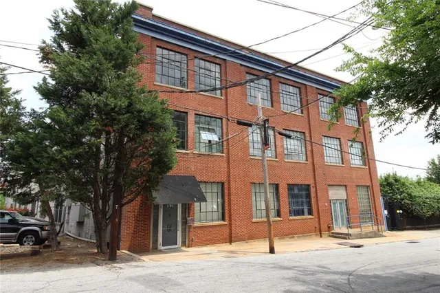 a front view of a building with a street