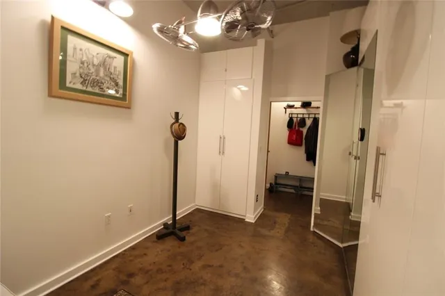 a view of a hallway with a room