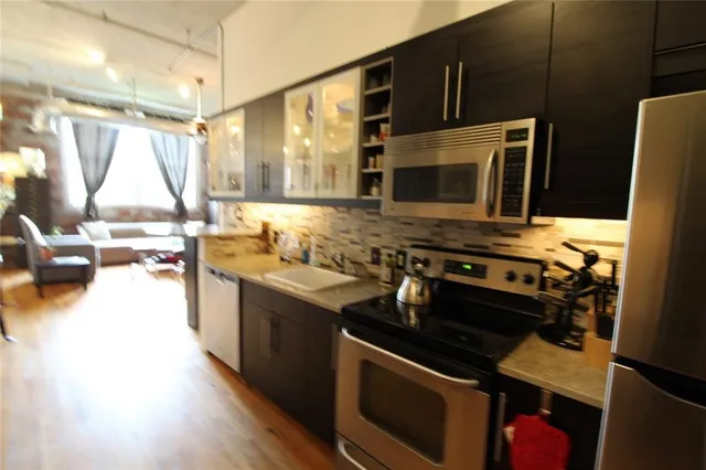 a kitchen with a stove and a microwave