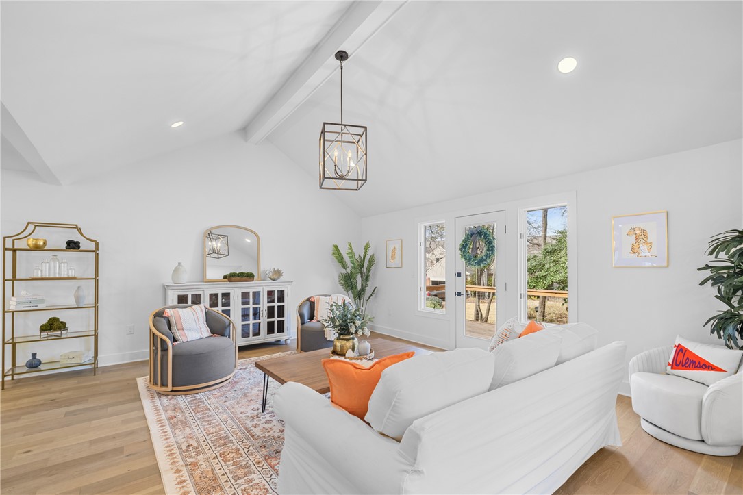 117 Riverpoint Drive Clemson, SC 29631 - Photo 15 of 47 Bright and airy living area featuring a vaulted ceiling and direct outdoor access.