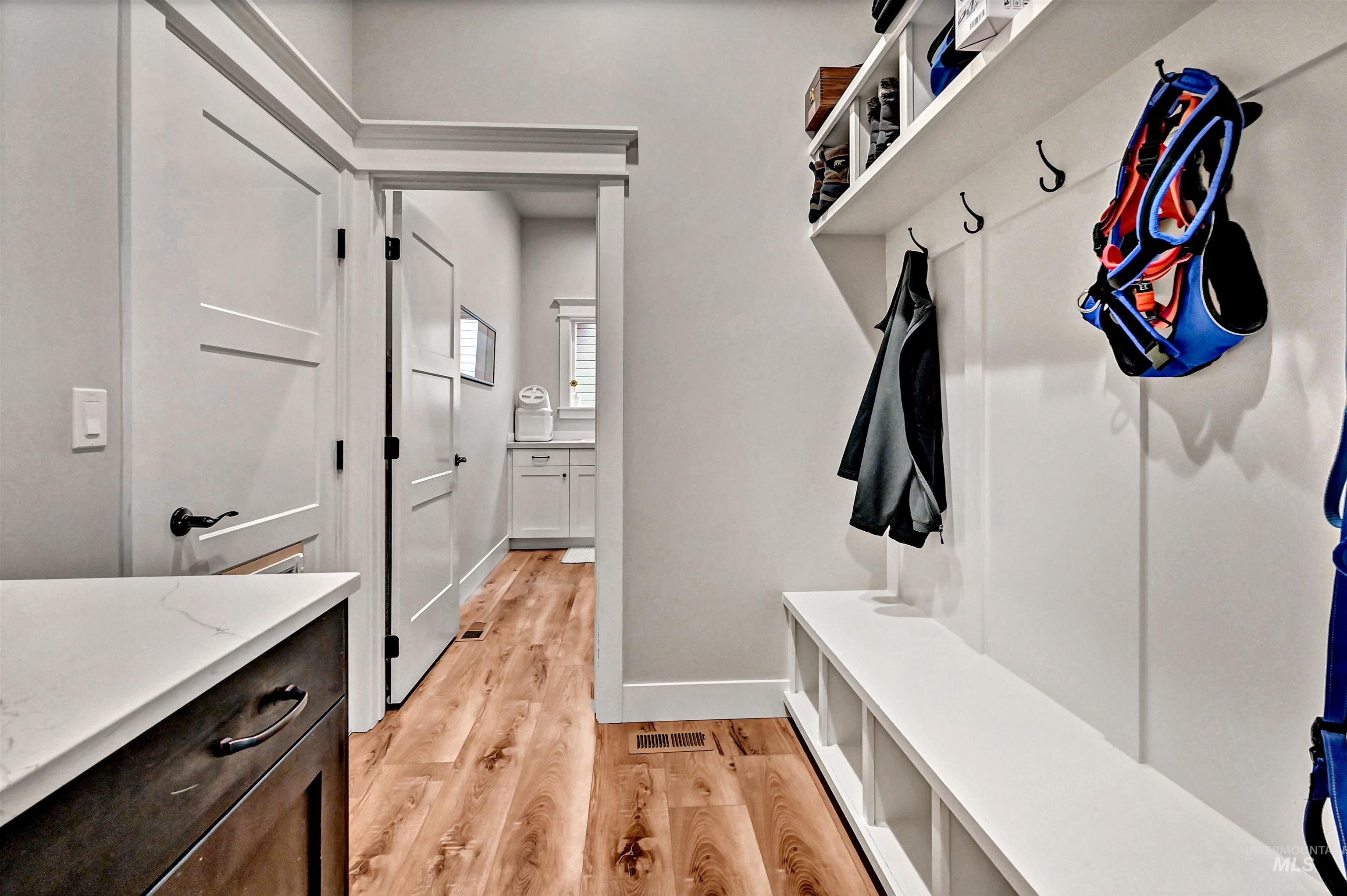 14964 Mortensen Court Caldwell, ID 83607 - Photo 17 of 38 Mudroom featuring light wood finished floors and baseboards