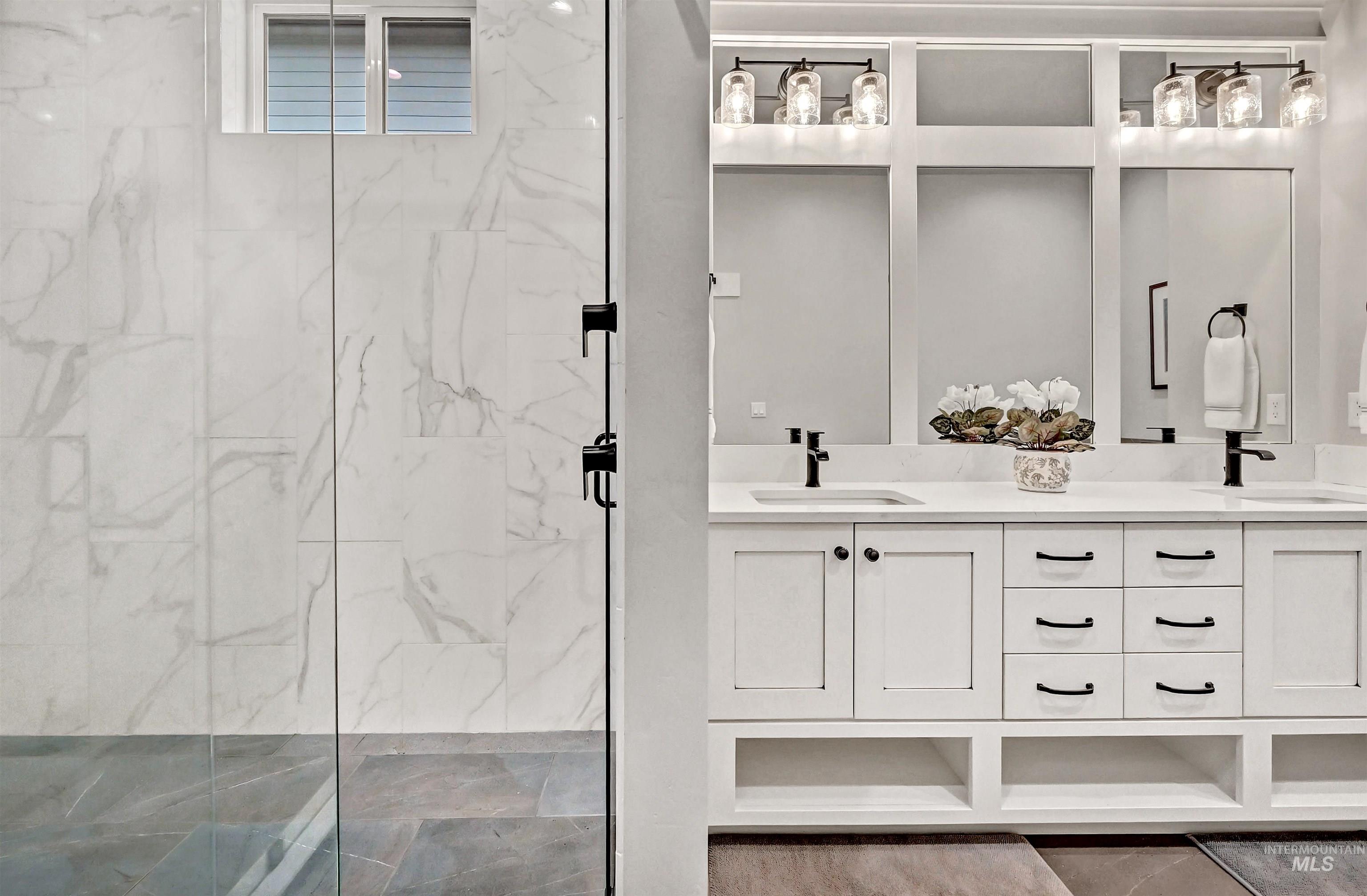 14964 Mortensen Court Caldwell, ID 83607 - Photo 23 of 38 Full bath featuring double vanity and a marble finish shower