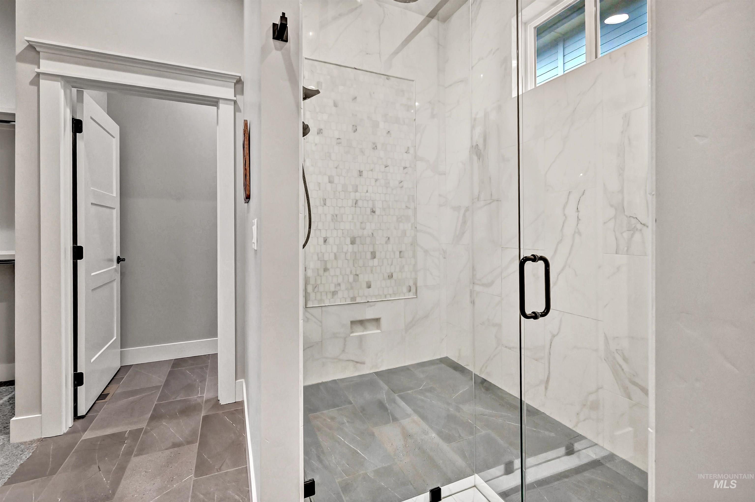 14964 Mortensen Court Caldwell, ID 83607 - Photo 24 of 38 Bathroom with a marble finish shower and light marble finish flooring