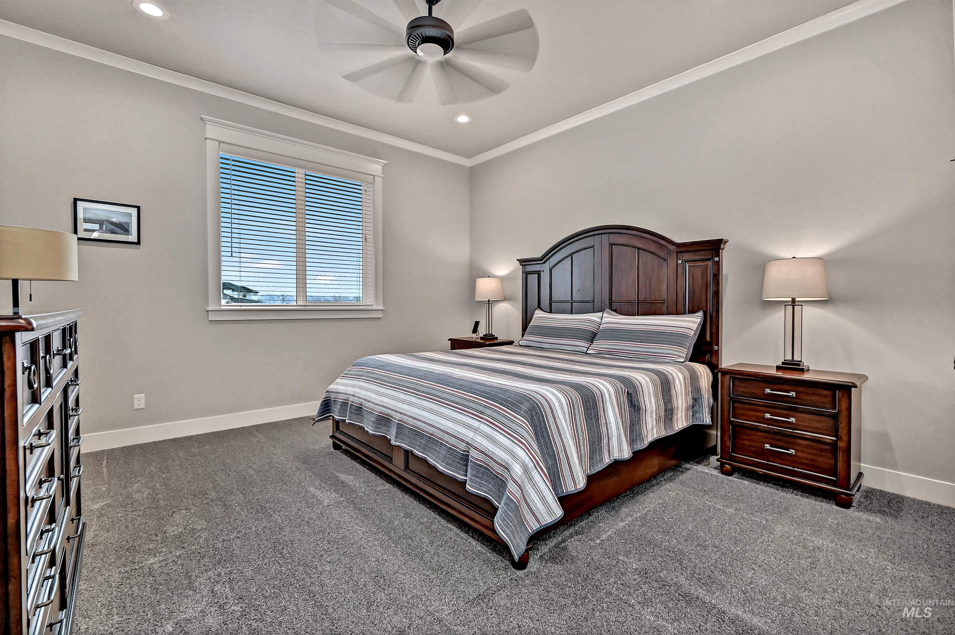 14964 Mortensen Court Caldwell, ID 83607 - Photo 25 of 38 Bedroom with dark colored carpet, crown molding, a ceiling fan, and recessed lighting