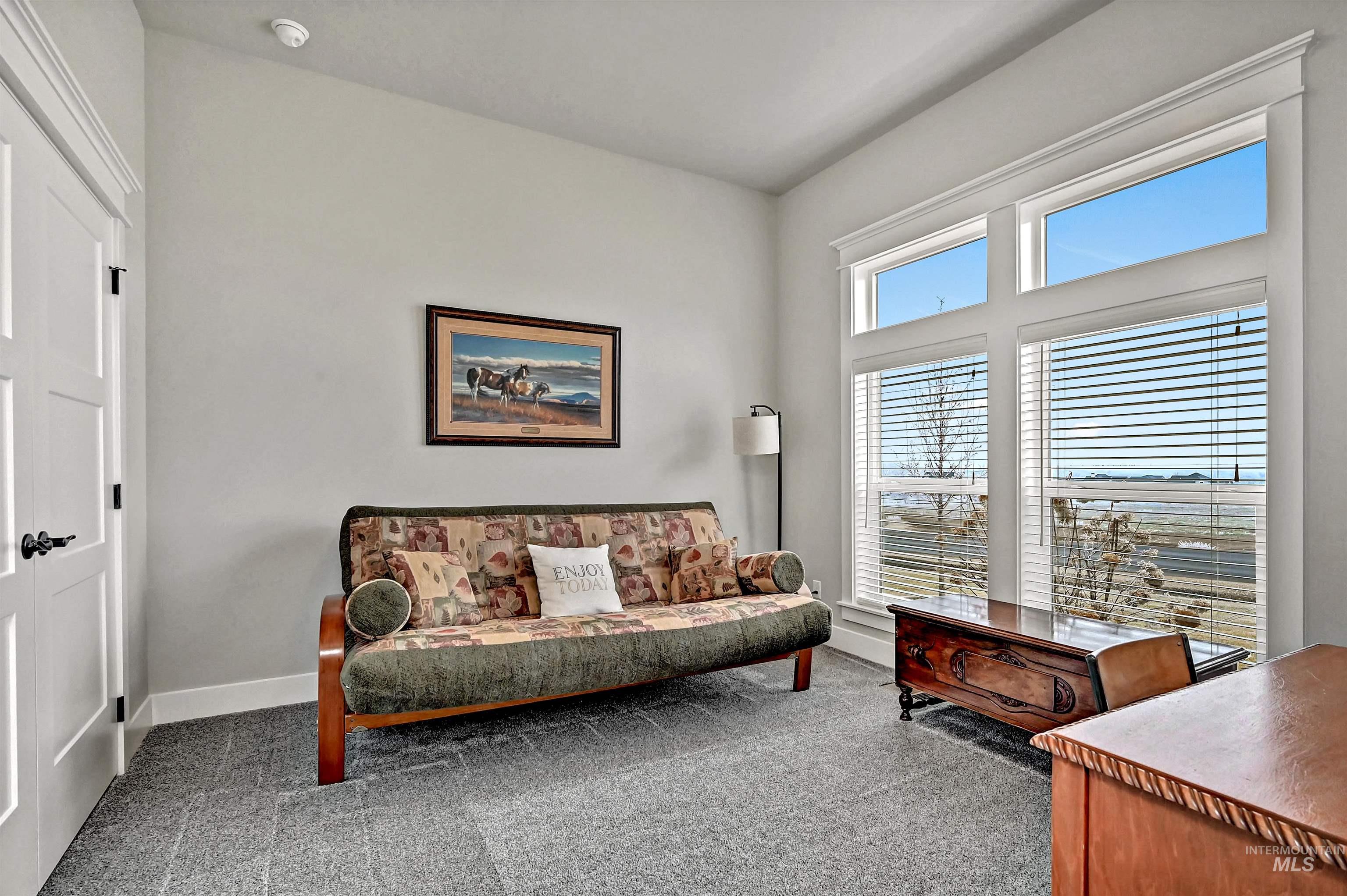 14964 Mortensen Court Caldwell, ID 83607 - Photo 27 of 38 Living area with carpet flooring and baseboards