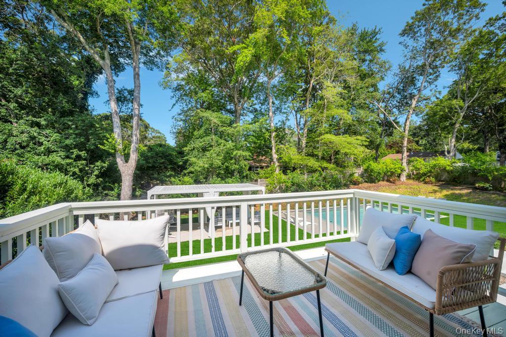 9 Pine Tree Road Southampton, NY 11968 - Photo 15 of 20 a view of a two chairs in the deck