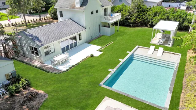 a aerial view of a house with a big yard
