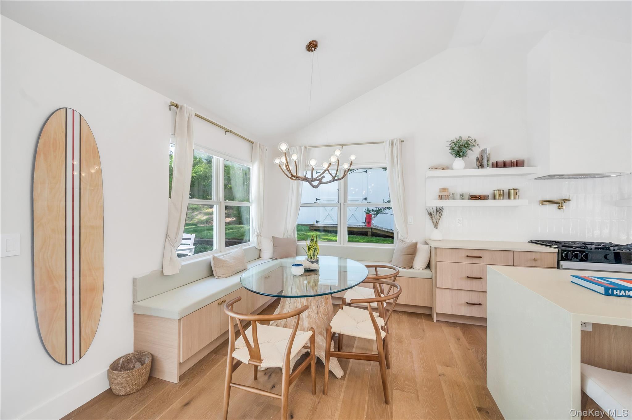9 Pine Tree Road Southampton, NY 11968 - Photo 4 of 20 a dining room with furniture a rug and wooden floor
