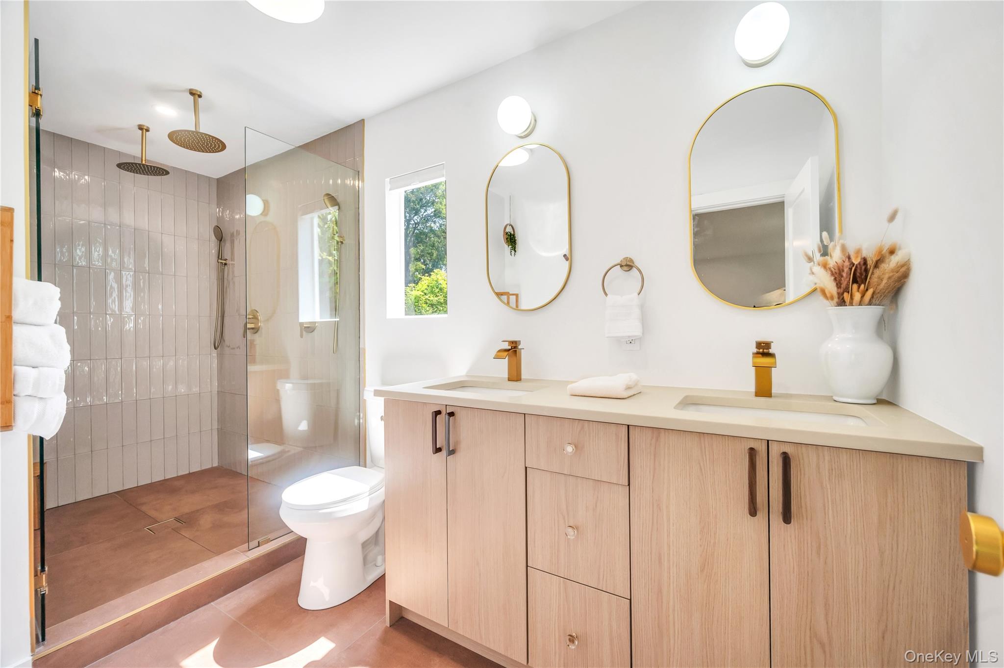 9 Pine Tree Road Southampton, NY 11968 - Photo 8 of 20 a bathroom with a double vanity sink mirror and toilet