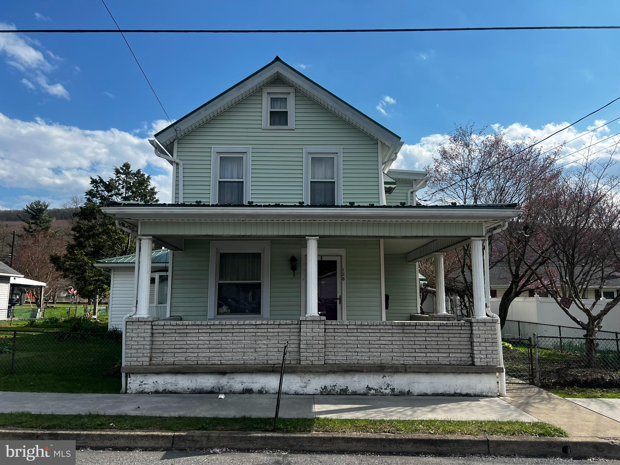 128 Main Street Lykens, PA 17048 - Photo 1 of 28 a view of a house with a yard