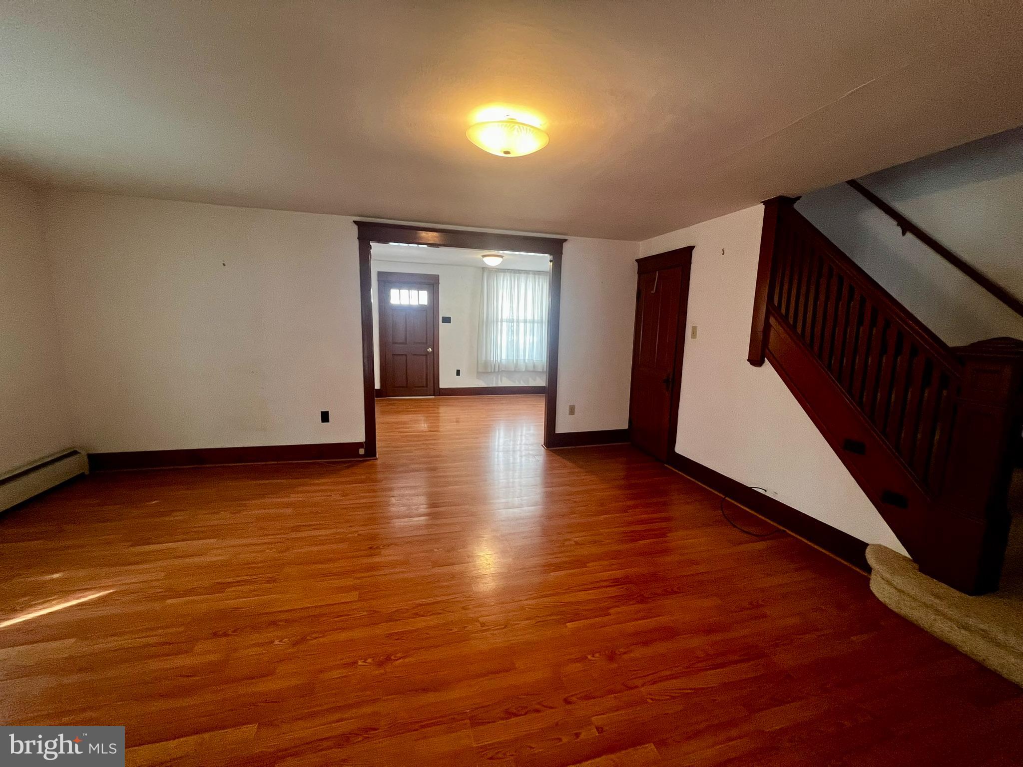 128 Main Street Lykens, PA 17048 - Photo 15 of 28 a view of a hallway with wooden floor