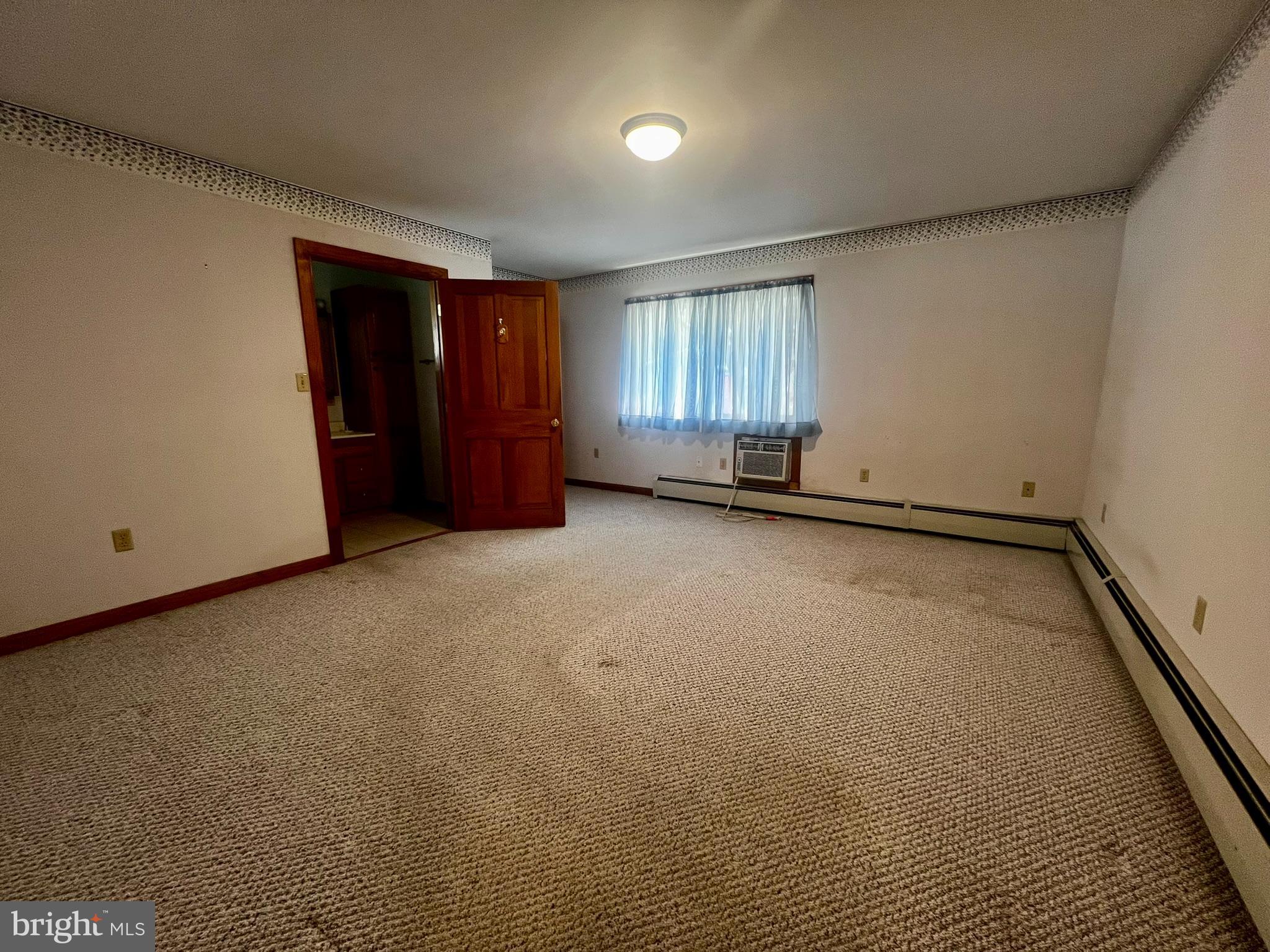 128 Main Street Lykens, PA 17048 - Photo 17 of 28 an empty room with windows