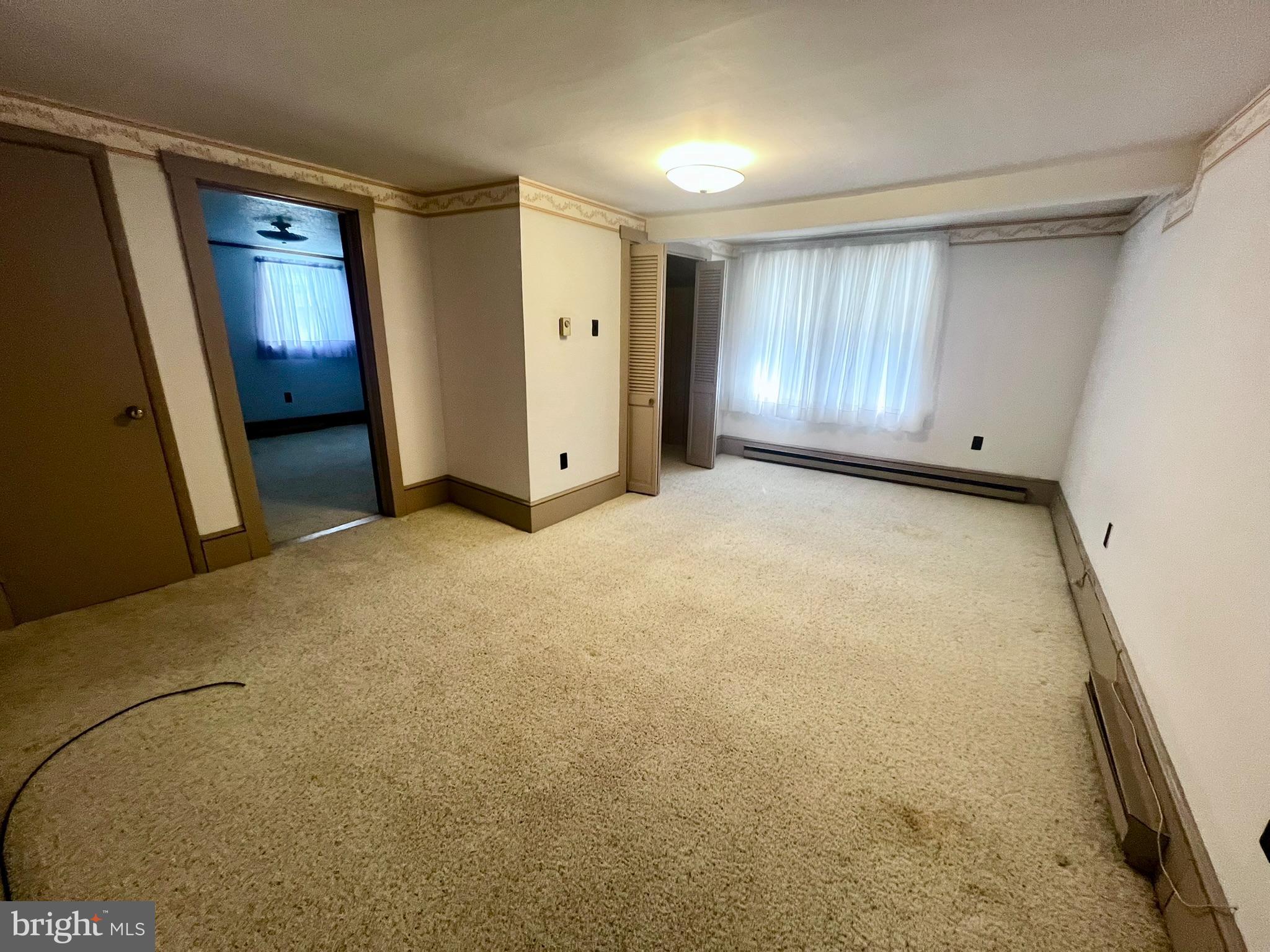 128 Main Street Lykens, PA 17048 - Photo 22 of 28 a view of an empty room and a window