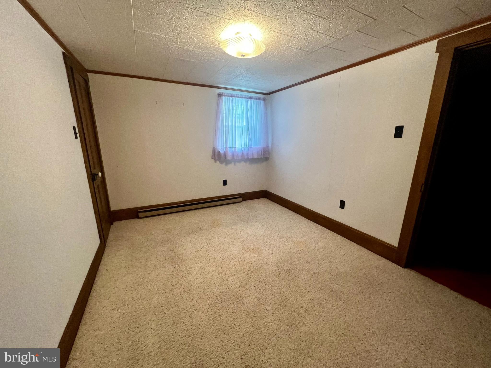 128 Main Street Lykens, PA 17048 - Photo 23 of 28 an empty room with windows