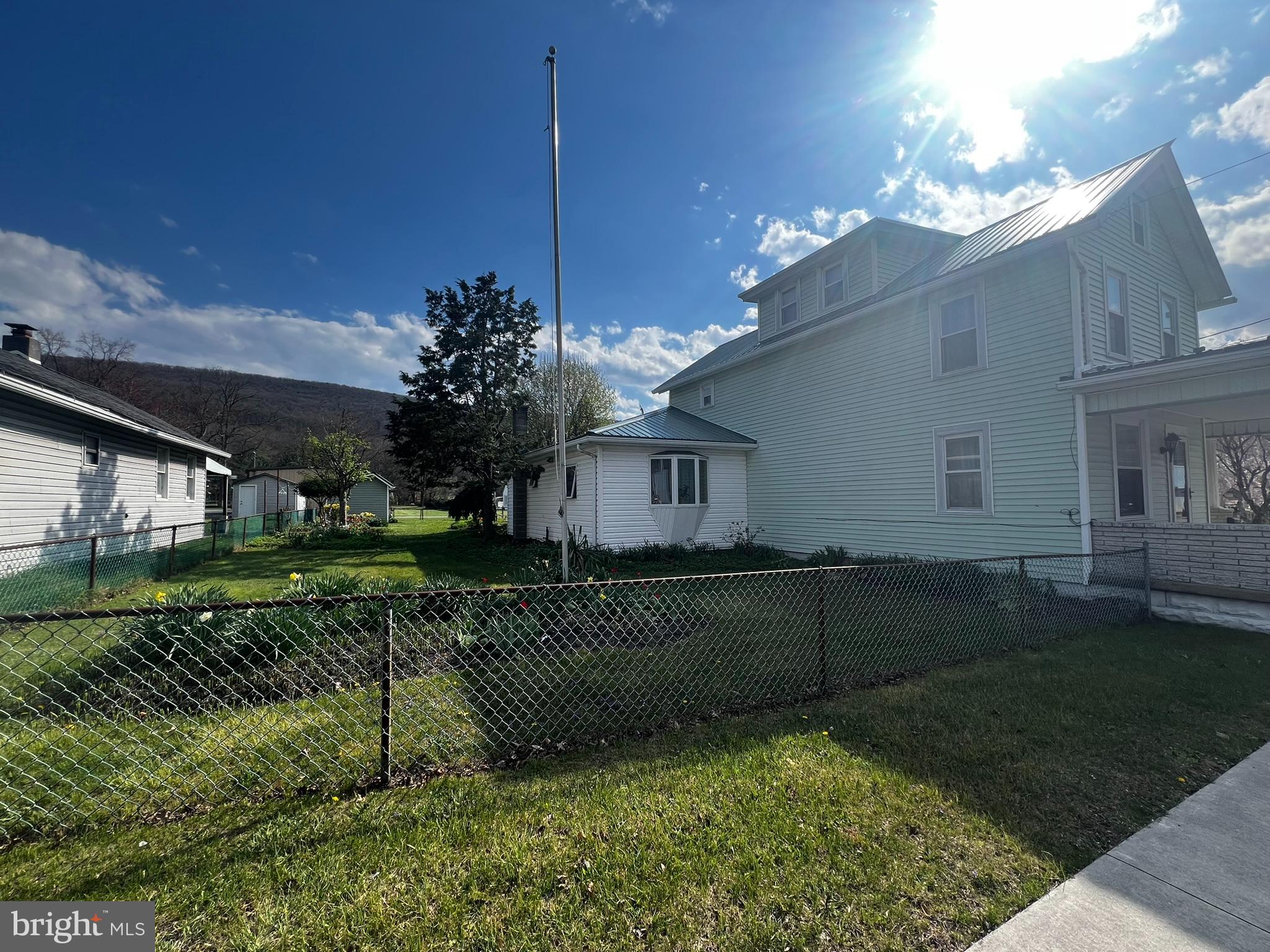 128 Main Street Lykens, PA 17048 - Photo 6 of 28 a view of a house with a back yard