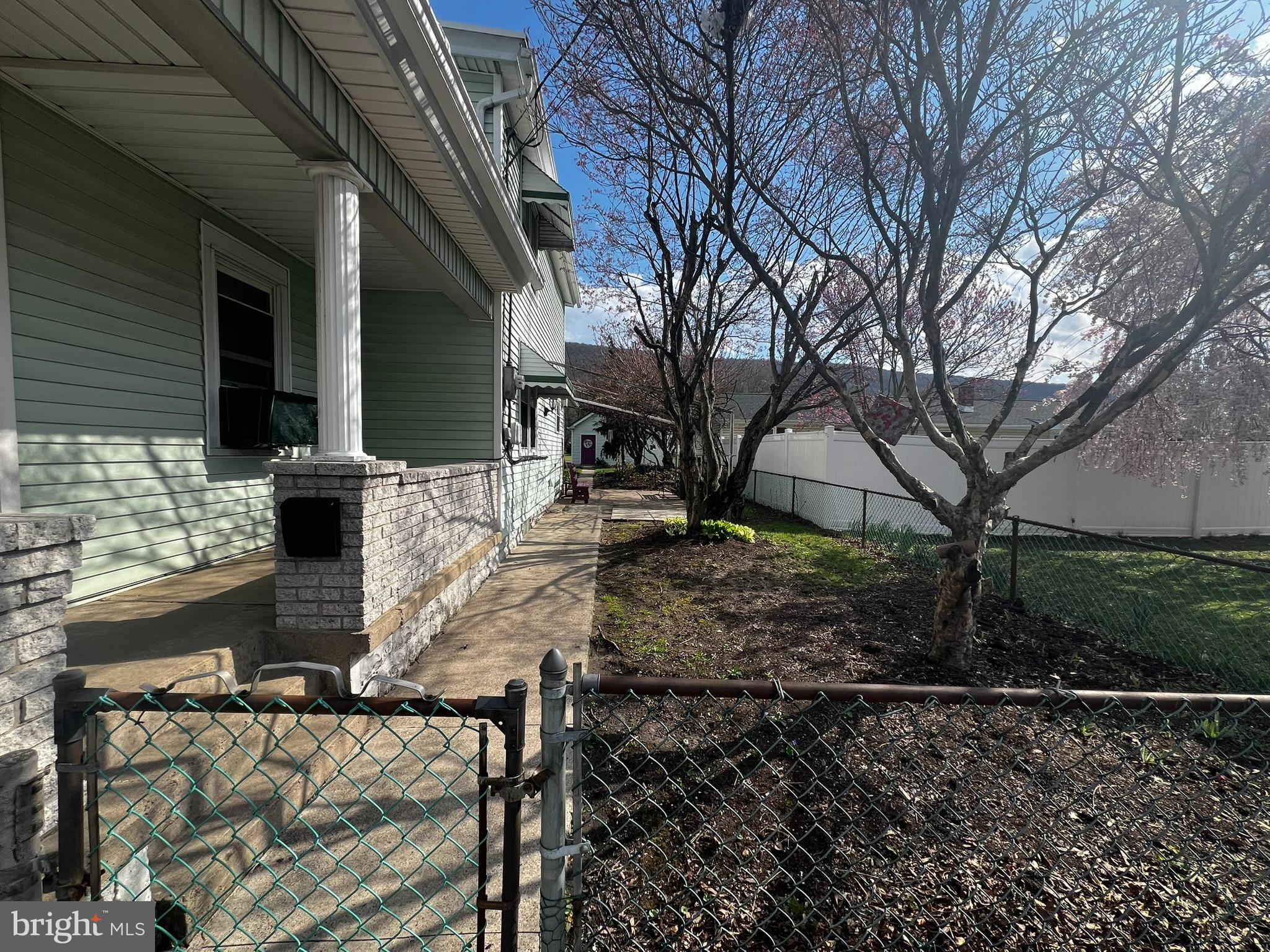 128 Main Street Lykens, PA 17048 - Photo 7 of 28 a view of a house with backyard