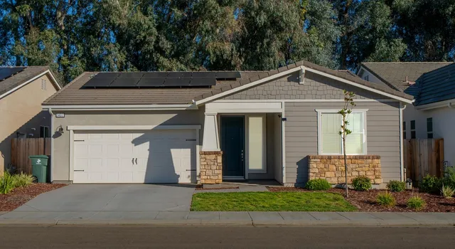 a front view of a house with a garage