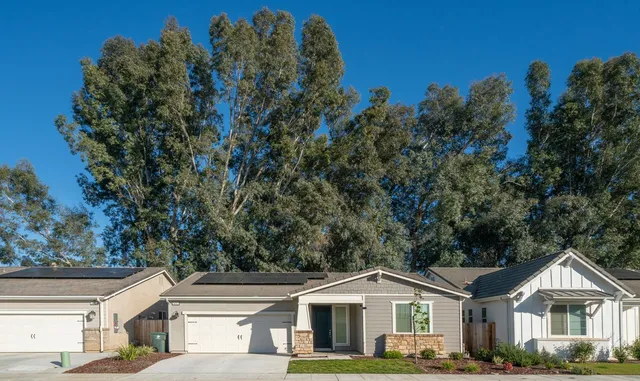 front view of a house with a yard