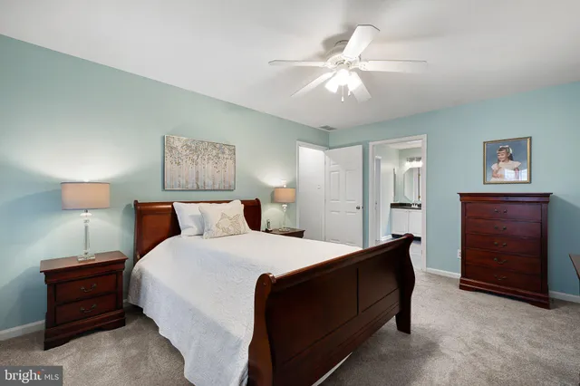 a bedroom with a bed and a night stand