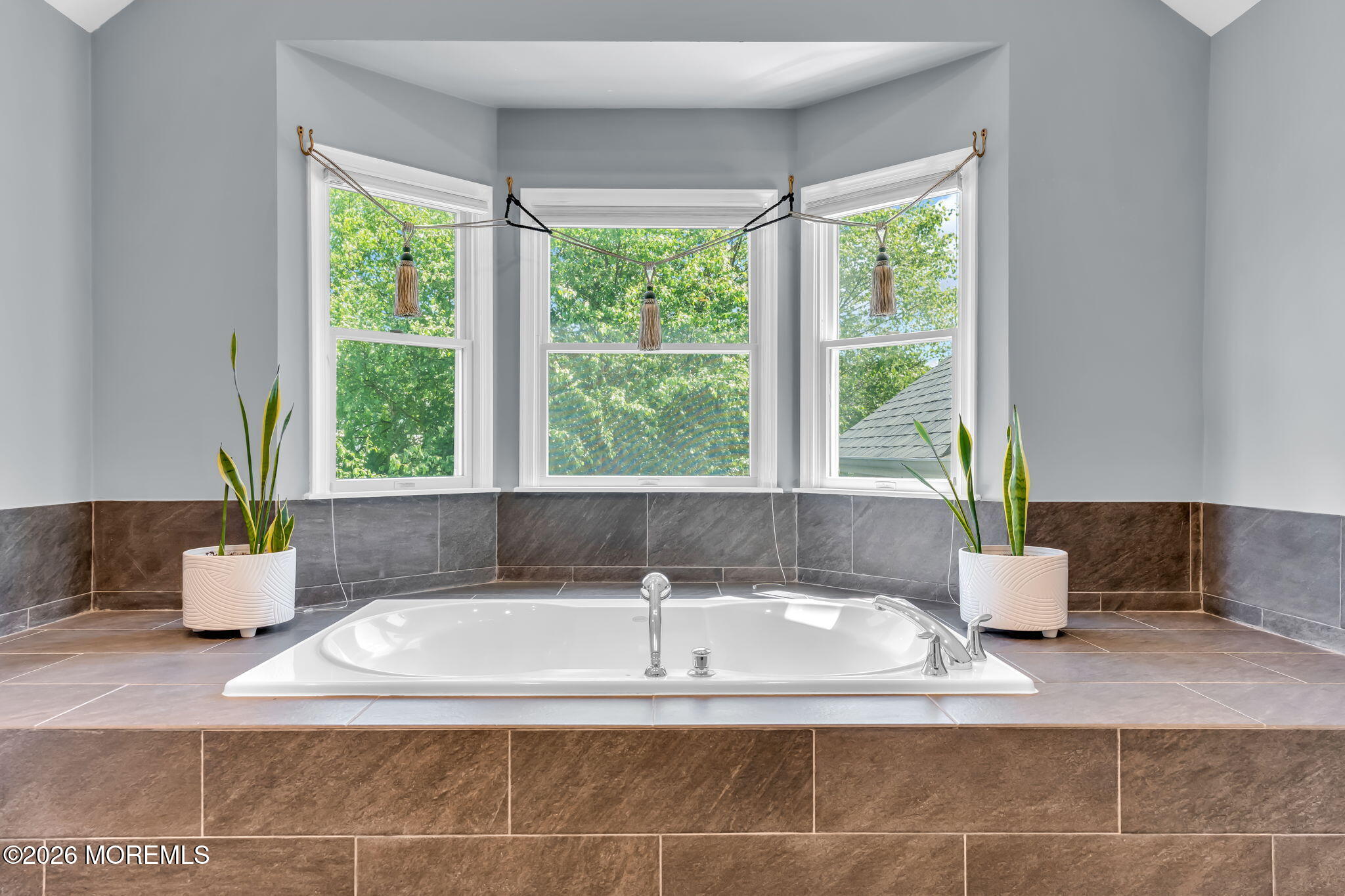 14 Diamond Hill Road Marlboro, NJ 07746 - Photo 43 of 79 a white bath tub sitting in a bathroom next to a window