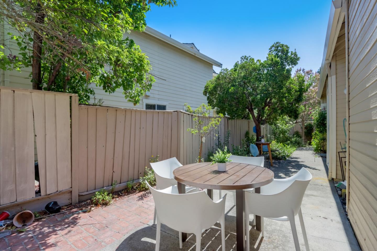 903 Springview Circle San Ramon, CA 94583 - Photo 31 of 41 a view of a table and chairs in back yard of a house