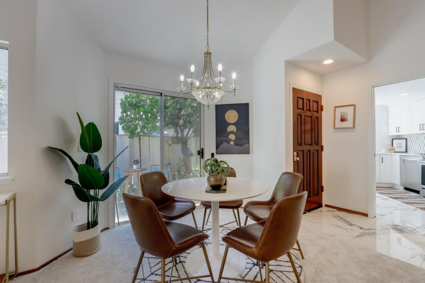 903 Springview Circle San Ramon, CA 94583 - Photo 8 of 41 a dining room with furniture a potted plant and a chandelier