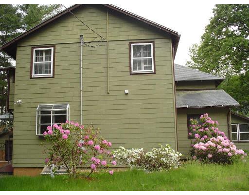 260 Sudbury Road Stow, MA 01775 - Photo 5 of 13 a front view of a house with a yard