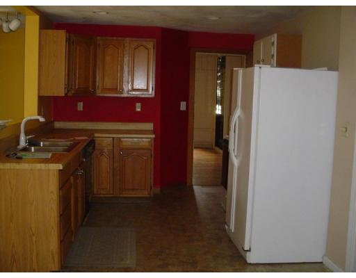 260 Sudbury Road Stow, MA 01775 - Photo 8 of 13 a kitchen with a refrigerator and cabinets