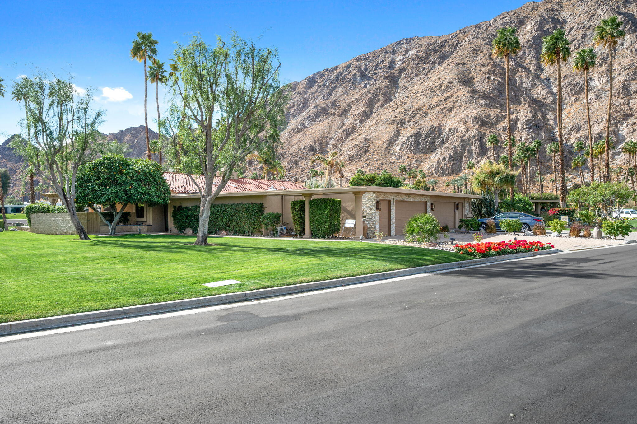77675 Seminole Road Indian Wells, CA 92210 - Photo 40 of 40 a view of road with plants and large trees