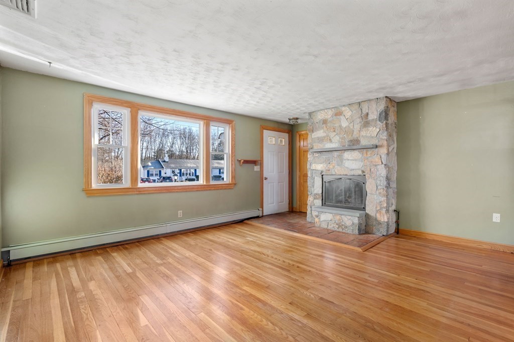 9 Wesson Road Ashland, MA 01721 - Photo 3 of 32 wooden floor in an empty room with a window