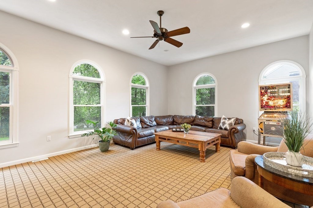 30 Castle Drive Sharon, MA 02067 - Photo 11 of 42 a living room with furniture and a large window