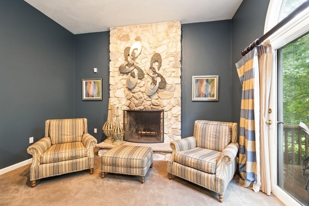 30 Castle Drive Sharon, MA 02067 - Photo 15 of 42 a living room with furniture and a fireplace