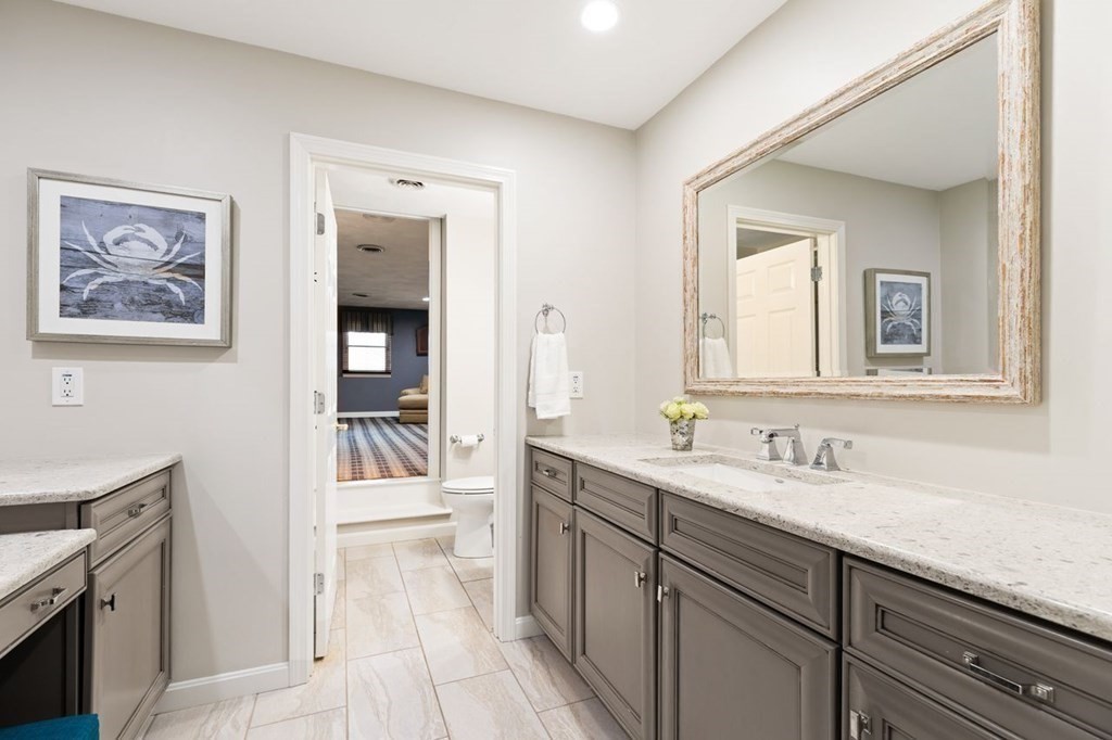 30 Castle Drive Sharon, MA 02067 - Photo 37 of 42 a spacious bathroom with a sink a mirror and a bathtub