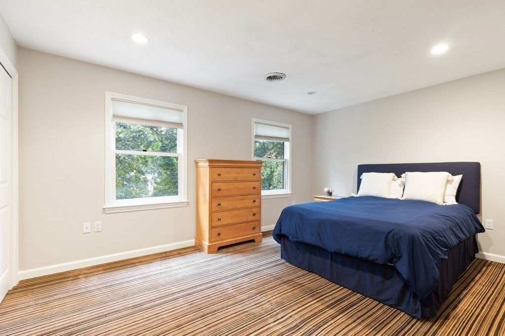 30 Castle Drive Sharon, MA 02067 - Photo 39 of 42 a bedroom with a bed and a window