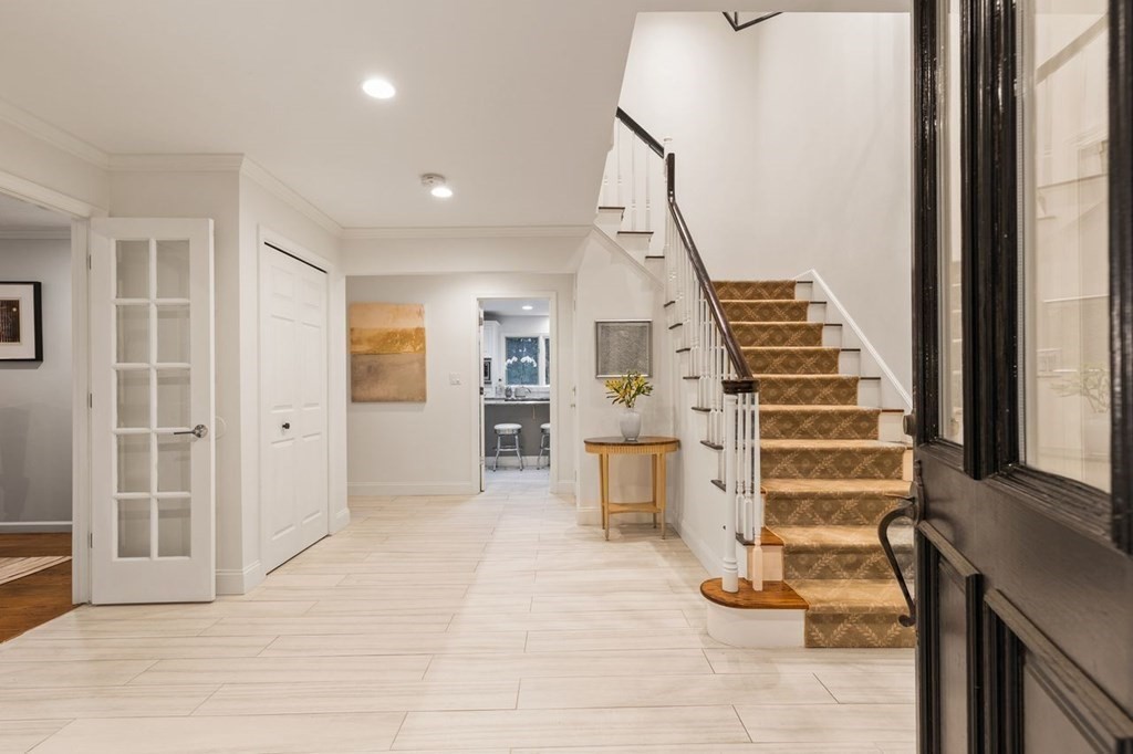 30 Castle Drive Sharon, MA 02067 - Photo 4 of 42 a view of a hallway with wooden floor and entryway