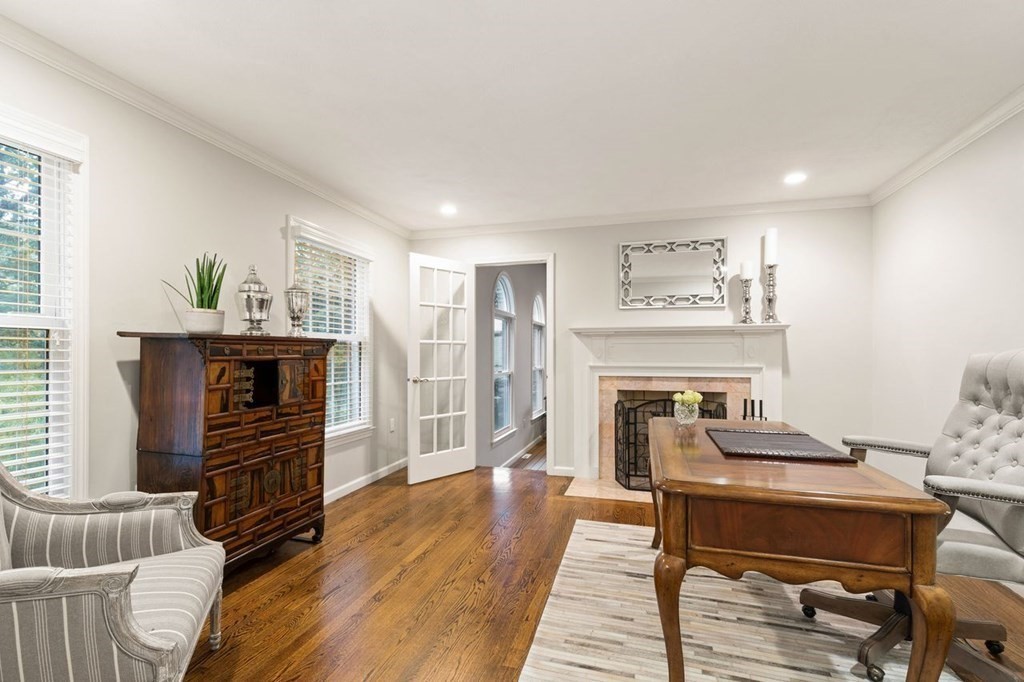 30 Castle Drive Sharon, MA 02067 - Photo 6 of 42 a living room with furniture and a fireplace
