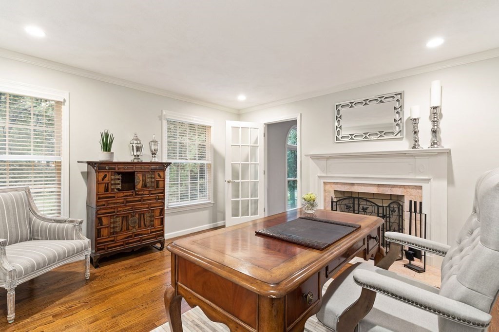30 Castle Drive Sharon, MA 02067 - Photo 8 of 42 a living room with furniture and a fireplace
