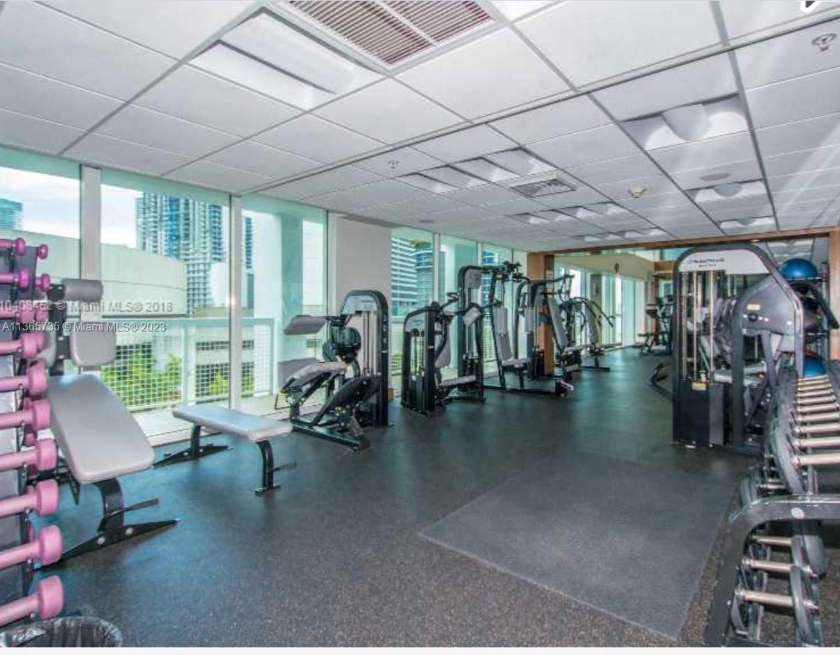 31 Southeast 5th Street, Unit 3309 Miami, FL 33131 - Photo 11 of 15 a view of a room with gym equipment
