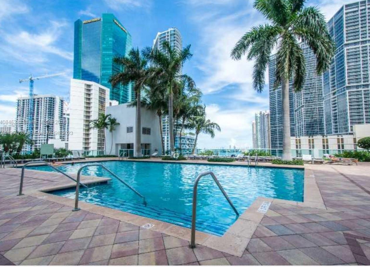31 Southeast 5th Street, Unit 3309 Miami, FL 33131 - Photo 9 of 15 a view of a swimming pool with a patio